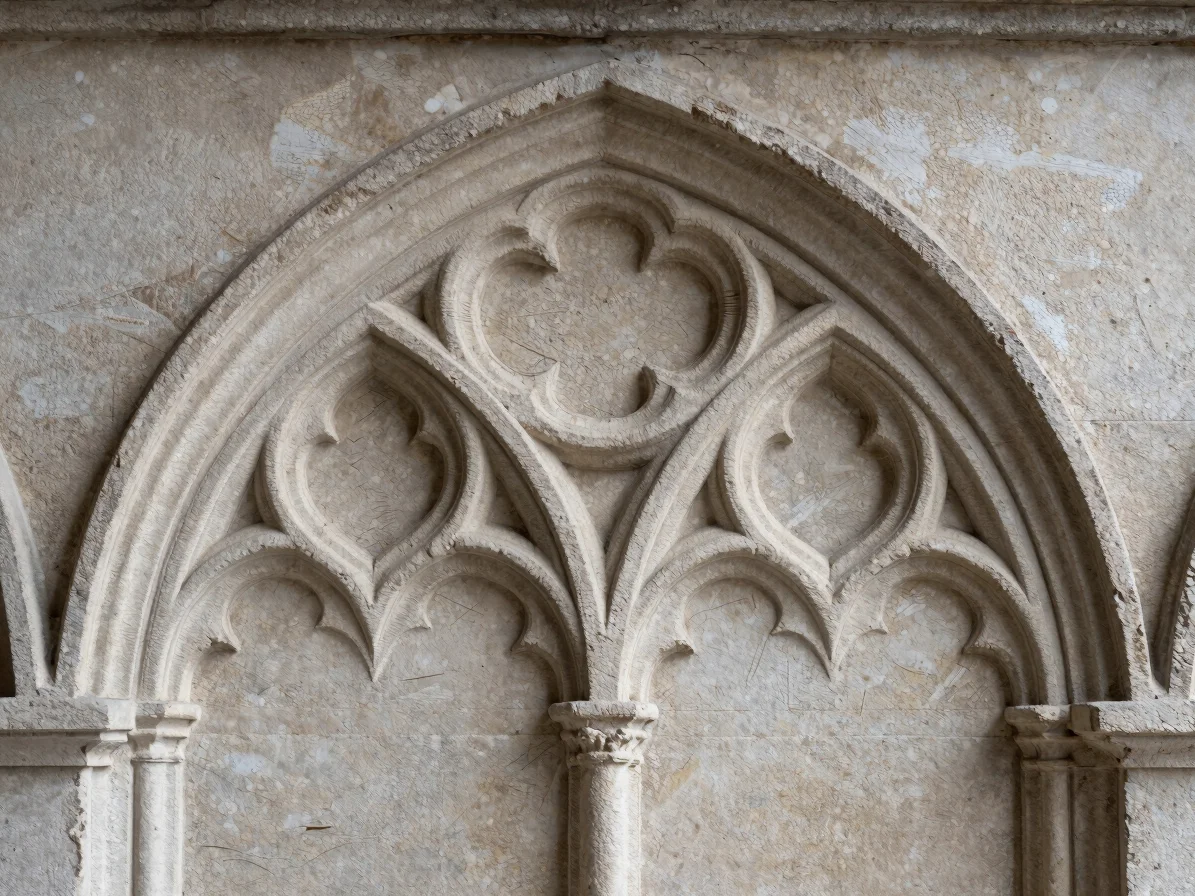 Quiet editorial documentary photograph of a carved Gothic tracery